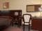 Двуспальная кровать, стул, большое зеркало в номере SUITE отеля HELIOPARK Residence